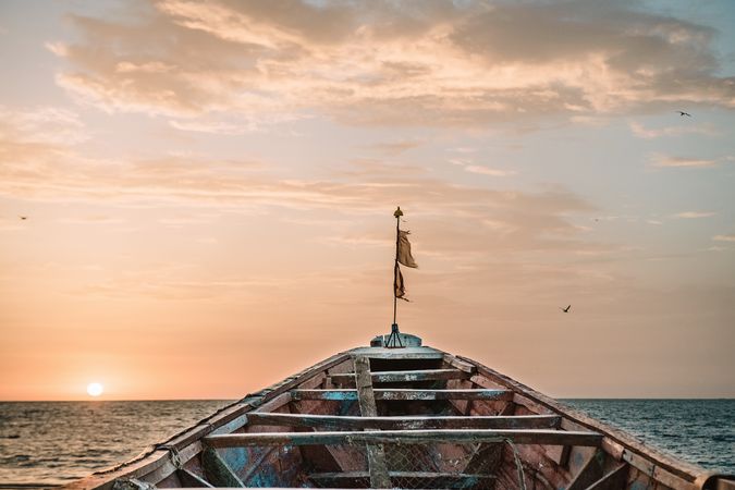 Old boat floating in sea