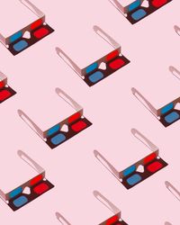 3D glasses on pink background