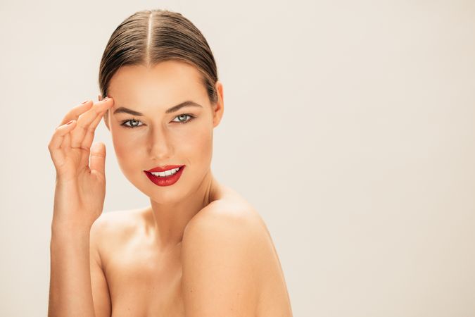 Female fashion model wearing red lipstick with copy space