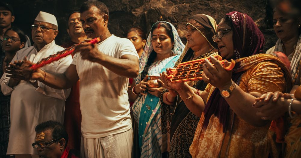 Hindu Religious Ceremony Traditions: of Group of People Burning Sages,Chanting and Giving Offerings to an Idol During Shiva Aarti Ritual in a Temple.