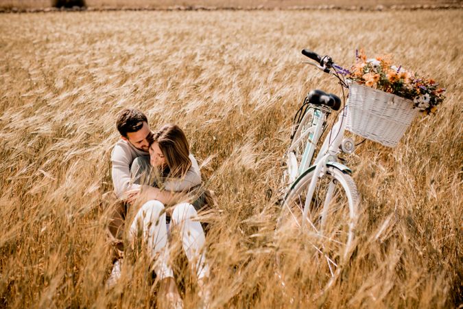 Serene lovers embracing on wheat field