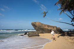 Woman in beachwear walking on sand