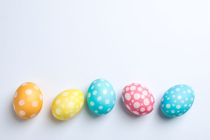Decorative Easter eggs on plain background, space for text. Top view