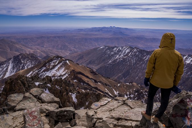 Hiker enjoying majestic view at mountain top