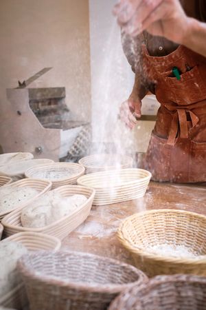 Leavened bread dough in the moulds resting to be baked.