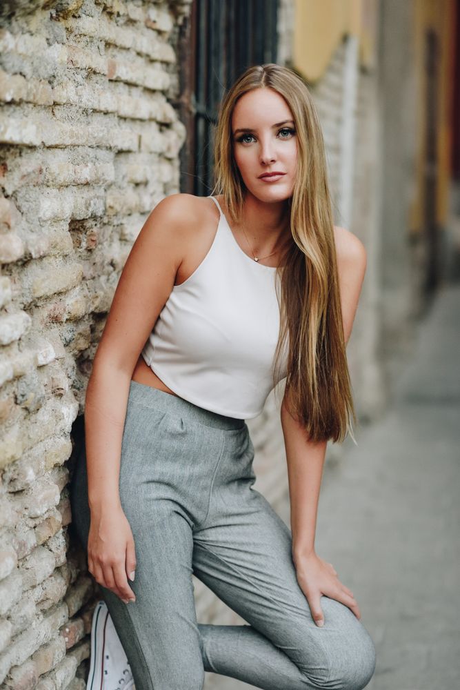Long haired chic woman standing outside