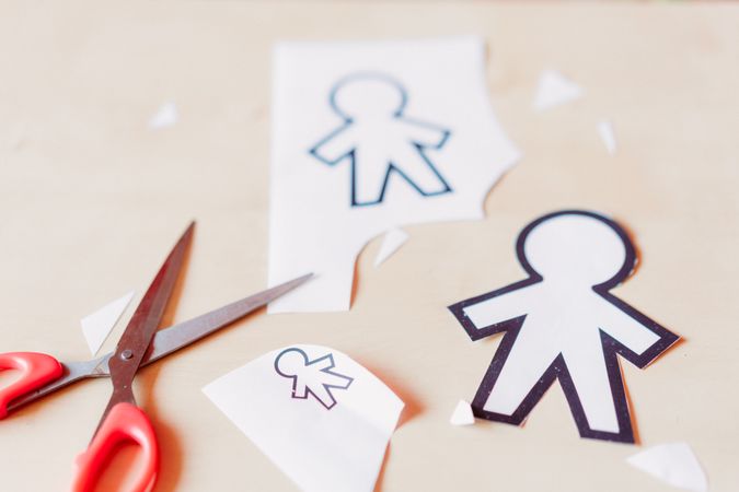 Funny paper toys near scissors