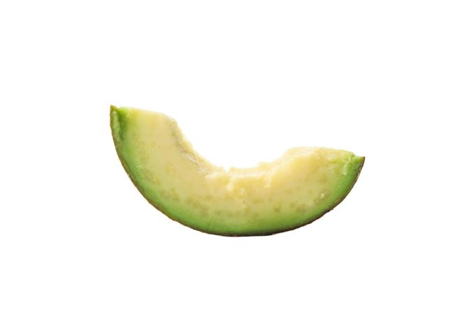 Ripe fresh avocado slice isolated on plain background