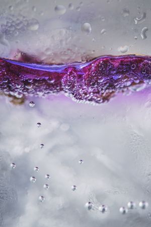Ice with lilac colored tonic
