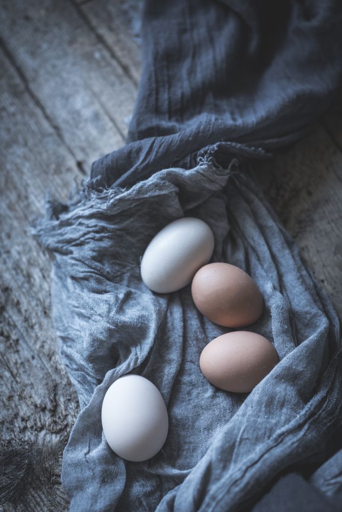 Raw eggs on tablecloth