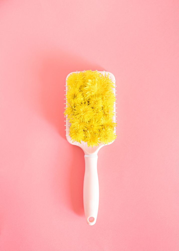 Hair brush with yellow spring flowers