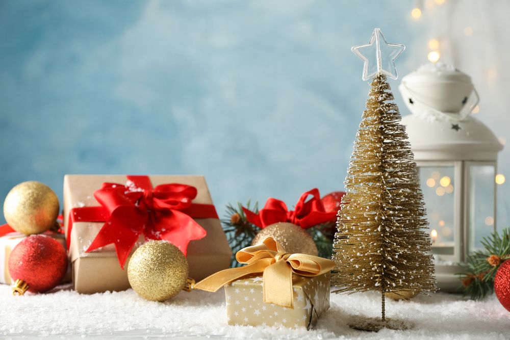 Christmas lantern and tree on decorated background, space for text
