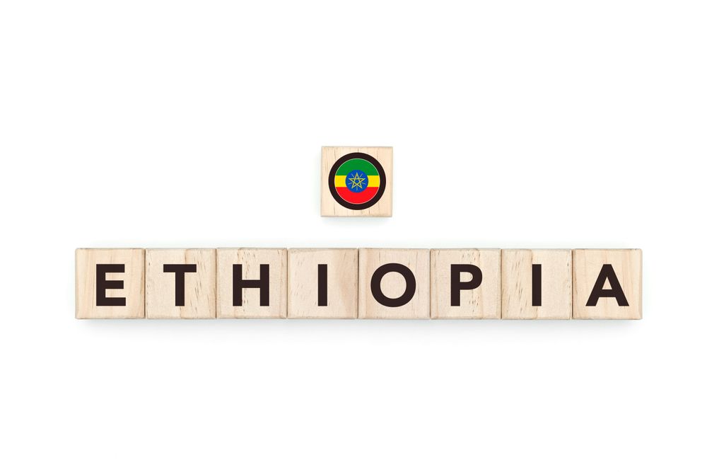 Wooden blocks bearing the name and flag of Ethiopia. Ethiopian and African Culture, national identity, travel, and geography in a copy space design.
