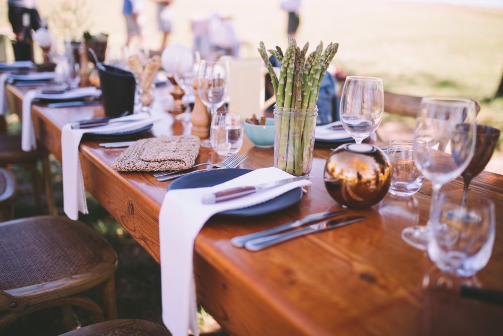 Formal dinning table setting accented with fresh asparagus