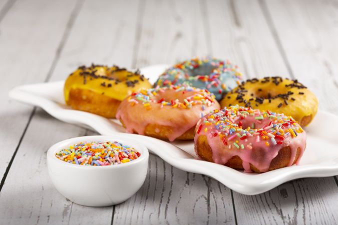 Delicious assorted colorful donuts on the table.