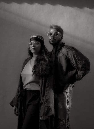 Man and woman in casual wearing standing in grayscale