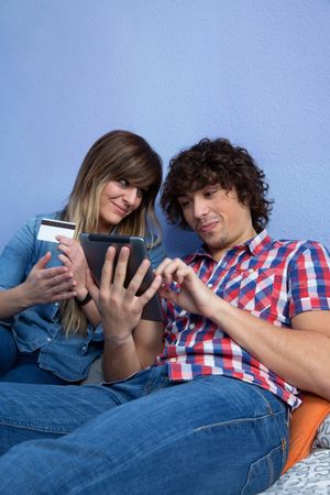 Woman and man considering making an online purchase