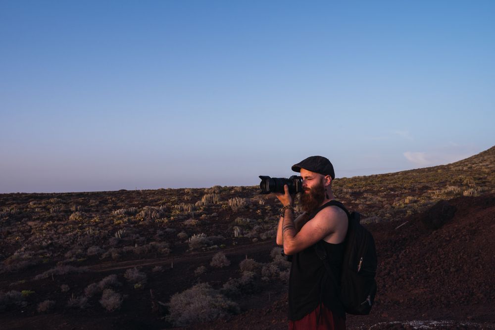 Photographer in desert landscape