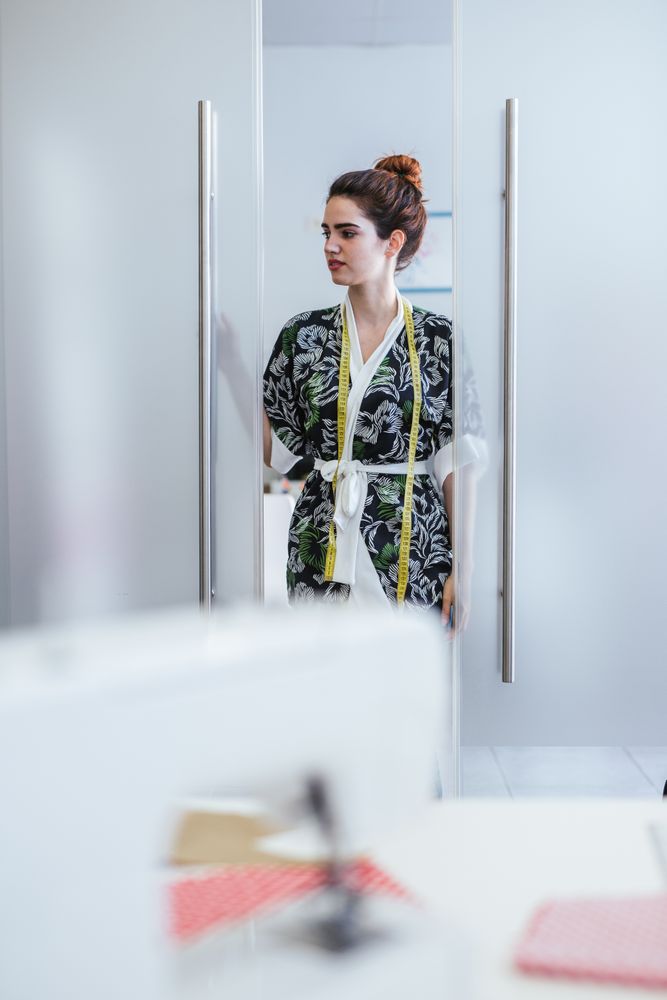 Woman in a sewing school