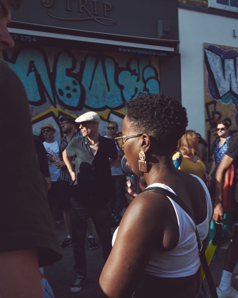 London, England, United Kingdom - August 25th, 2019: Woman in front of street art in London