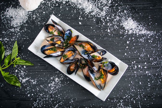 Steamed mussels with Thai sauce in plate