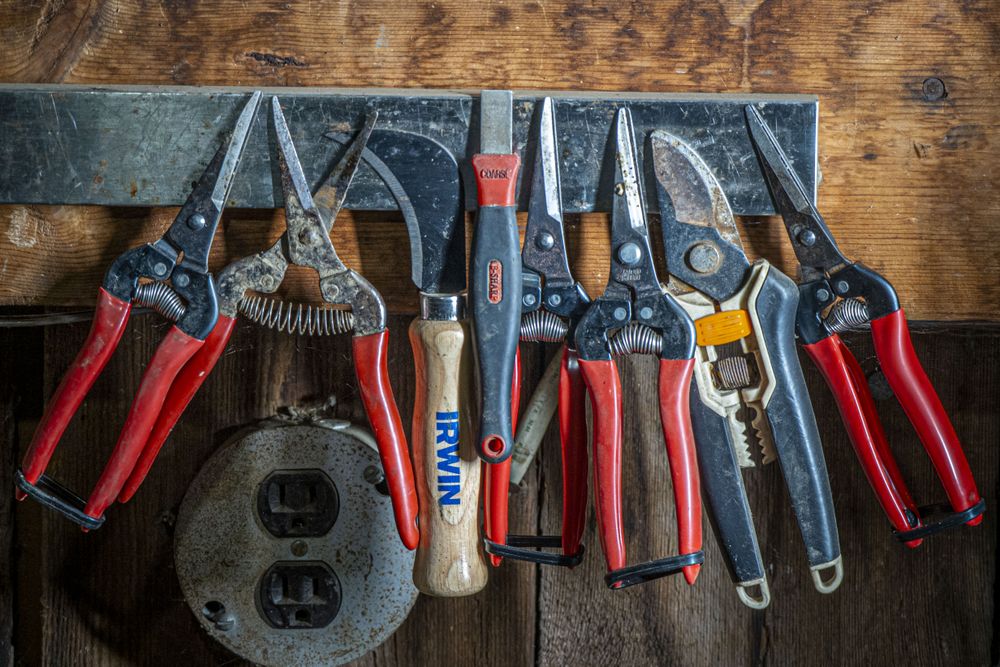 Copake, New York - May 19, 2022: Tools hanging on wall in workshop