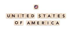Wooden blocks bearing the name and flag of United States Of America. American Culture, national identity, travel, and geography in a copy space design.