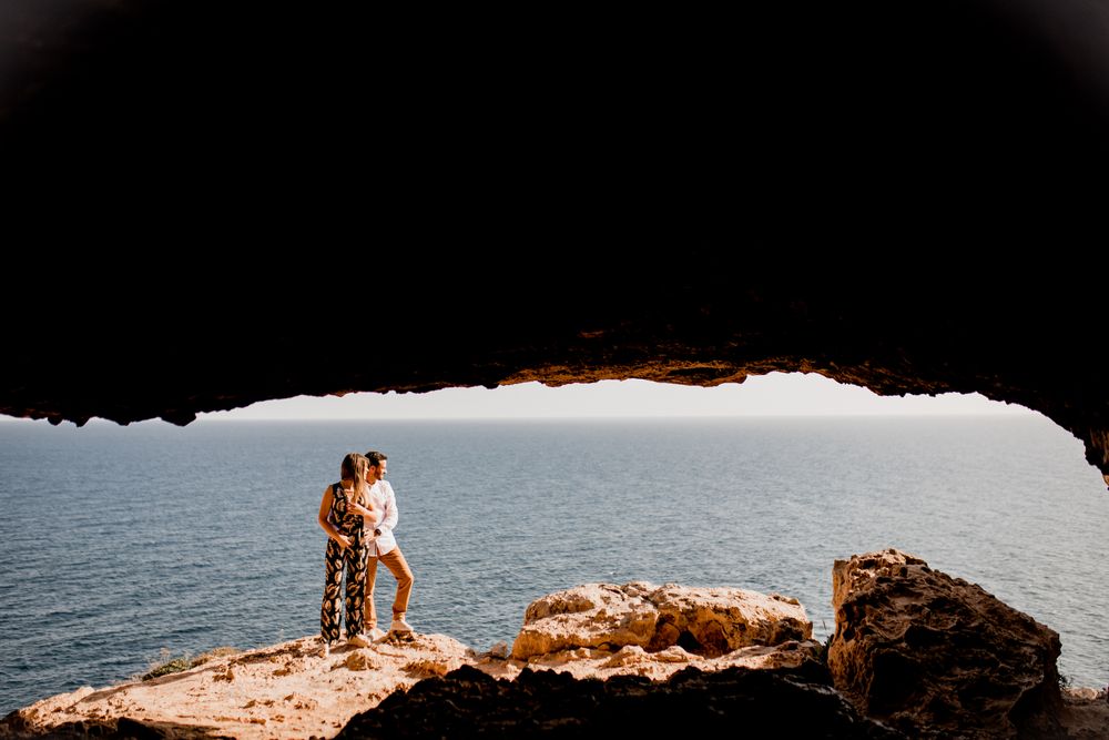 Couple embracing on rock