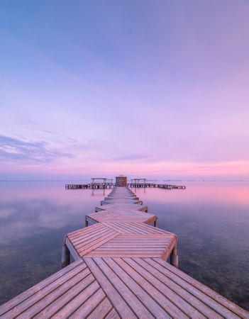 Wooden pier on cloudy evening