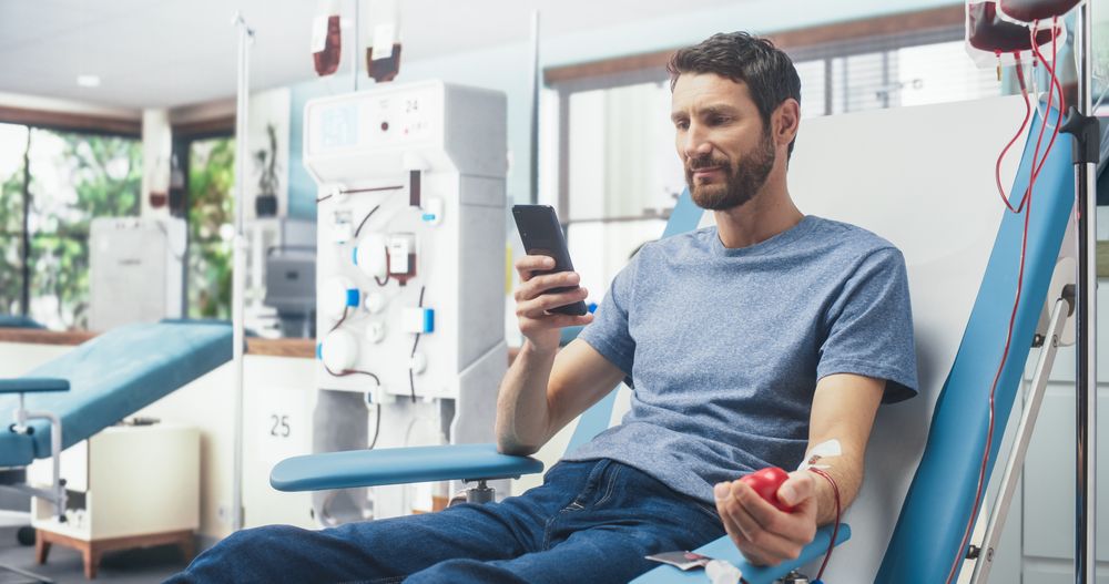 Man Donating Blood For People In Need In Hospital.