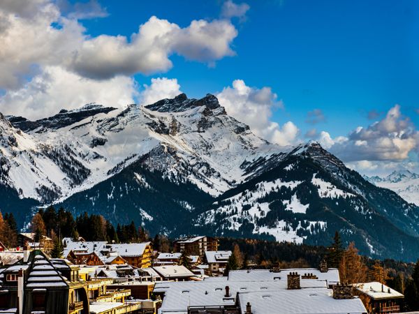 Swiss Alps winter landscape with snow and sun, mountains in Europe