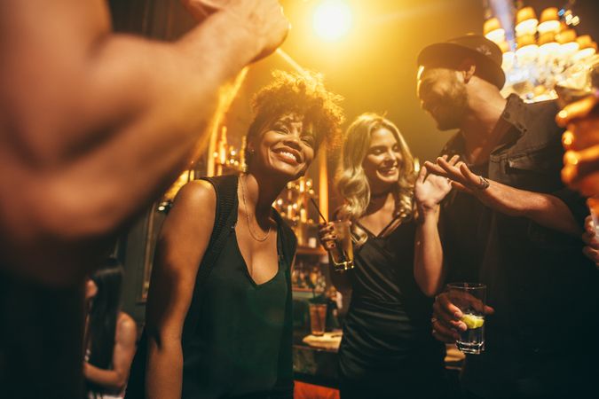 Group of friends enjoying party at nightclub