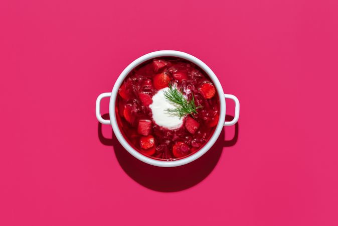 Beetroot soup bowl minimalist on pink table