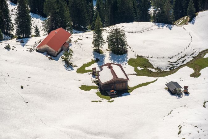 Cabin in the Bavarian Alps surrounded by snow, high angle view