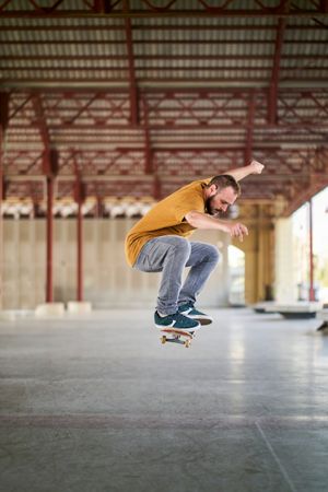 Young man doing an ollie with his skateboard