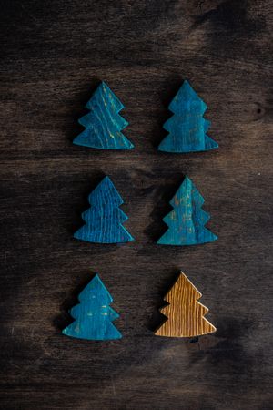 Wooden tree ornaments on wooden table