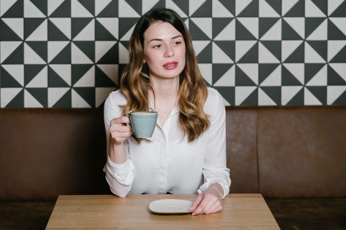 Young woman sitting at cafe