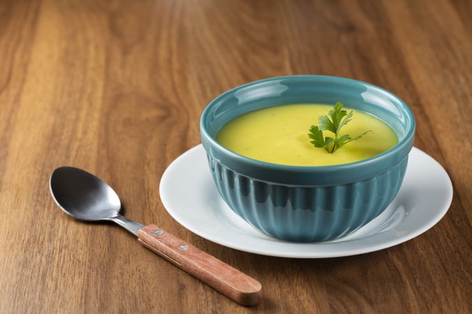 Bowl with onion soup and croutons on the table.