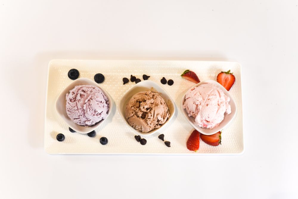 Top view of three different flavored ice cream scoops