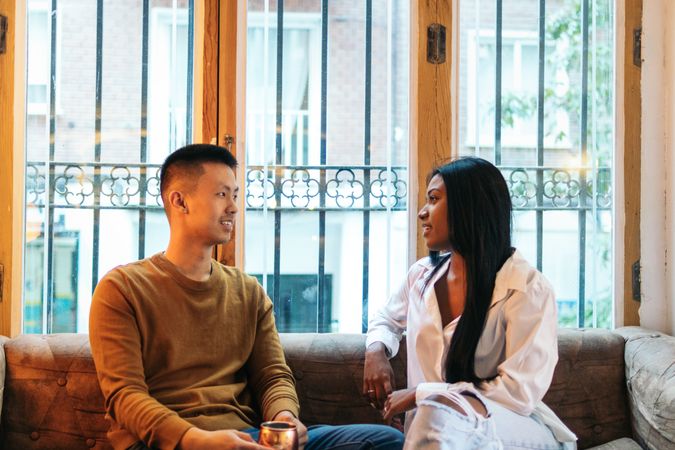 Asian man and Black Latina woman on a date