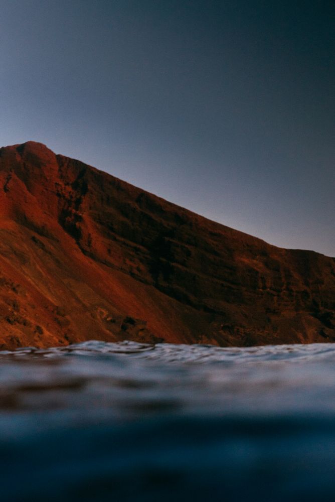 View of red cliff from the ocean