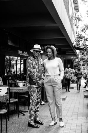 Full length shot of man and woman in fashionable clothes on the street
