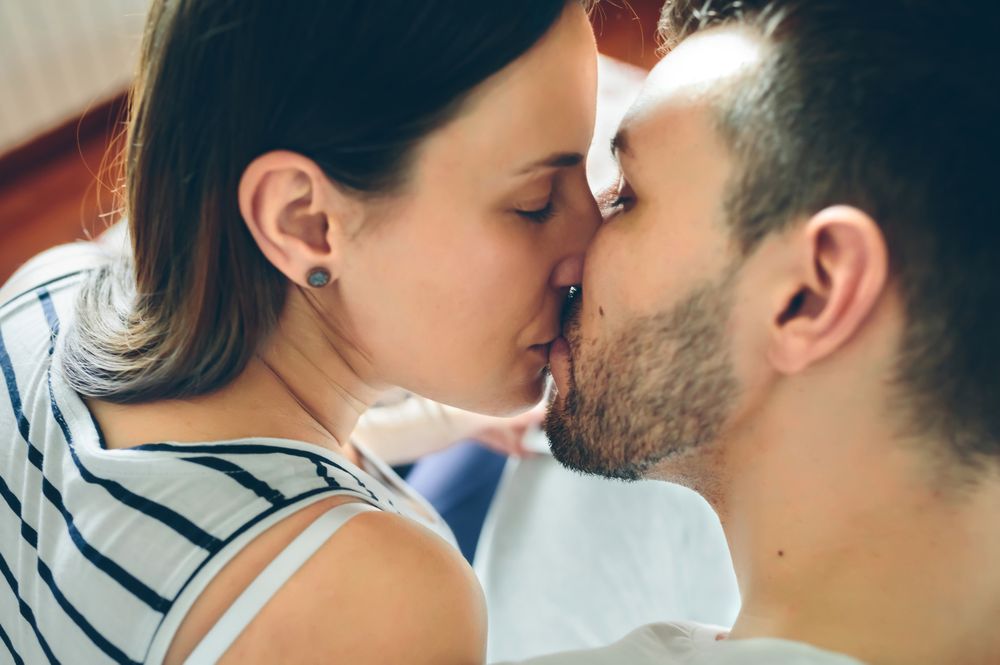 Top view of kissing couple
