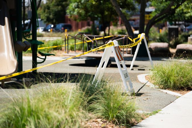 Caution barriers and tape at city playground