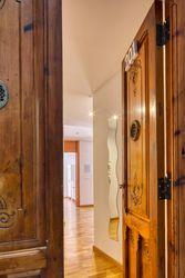 Interior of flat through open wooden doors