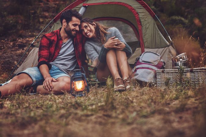 Romantic couple spending quality time on a camping holiday