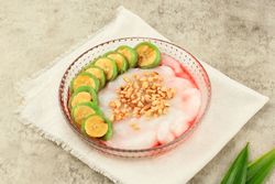 Glass bowl of es pisang ijo, Indonesian dessert