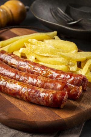 Grilled German sausage with french fries.