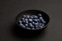 Bowl with ripe blueberries
