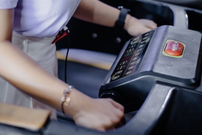 Activating Cardio Machine: Person Interacting with Treadmill Machine